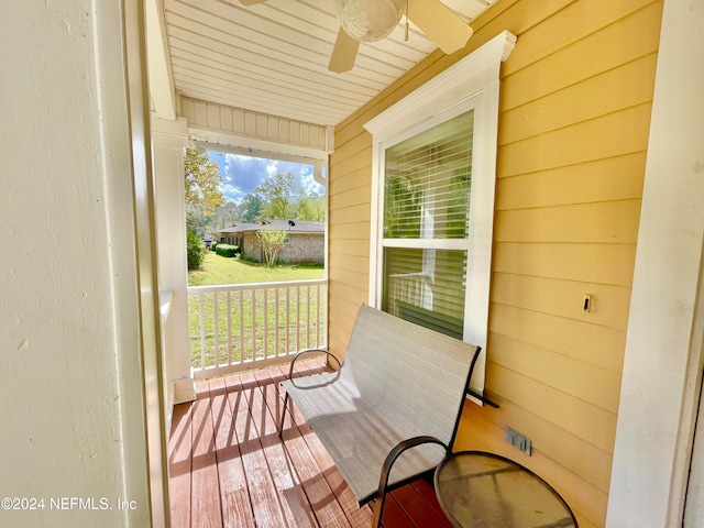 exterior space with ceiling fan