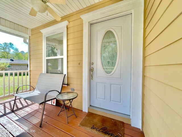 property entrance featuring a porch and ceiling fan