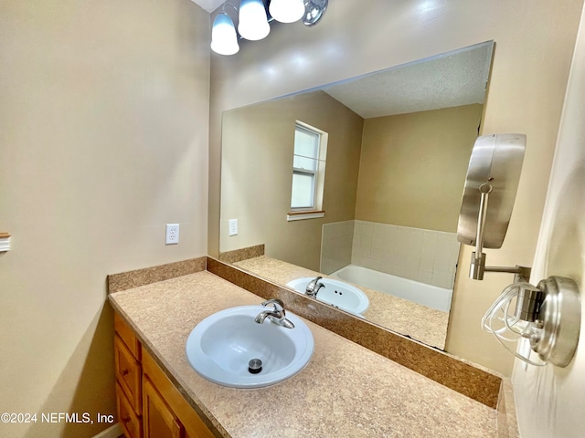 bathroom featuring vanity and a textured ceiling