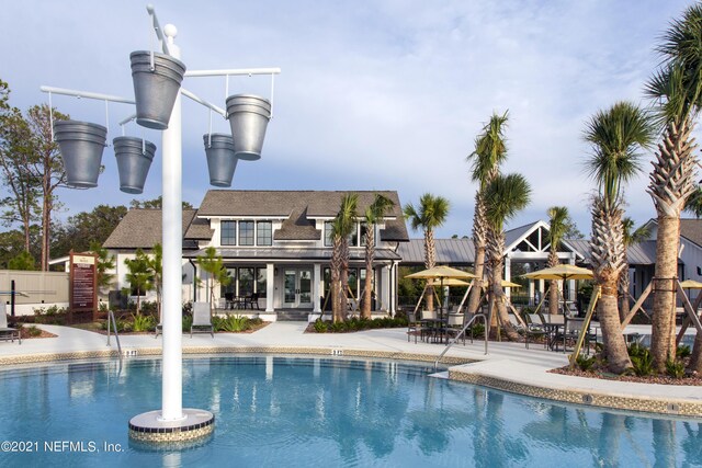 63 Bird Watch Ct, Saint Augustine, FL 32092 - community pool with french doors, a patio area, and fence