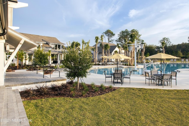 63 Bird Watch Ct, Saint Augustine, FL 32092 - community pool with a yard and a patio area