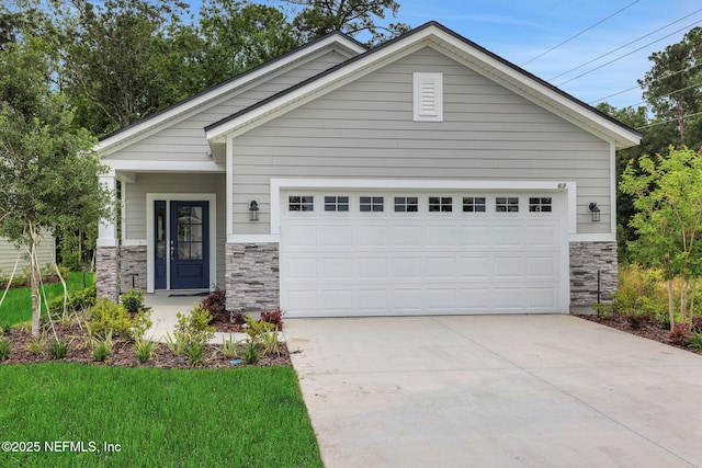 63 Bird Watch Ct, Saint Augustine, FL 32092 - view of front of property with stone siding, concrete driveway, and an attached garage