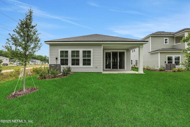 63 Bird Watch Ct, Saint Augustine, FL 32092 - back of property featuring a lawn, a patio area, and central air condition unit