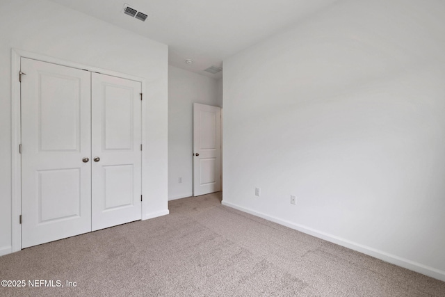 63 Bird Watch Ct, Saint Augustine, FL 32092 - unfurnished bedroom featuring carpet, a closet, and baseboards