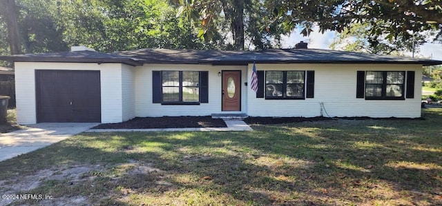 single story home featuring a front yard and a garage