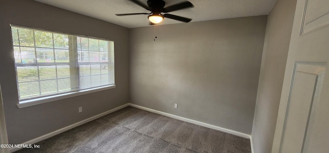 empty room with carpet flooring and ceiling fan