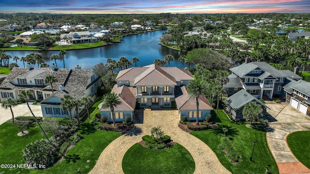 bird's eye view featuring a water view and a residential view