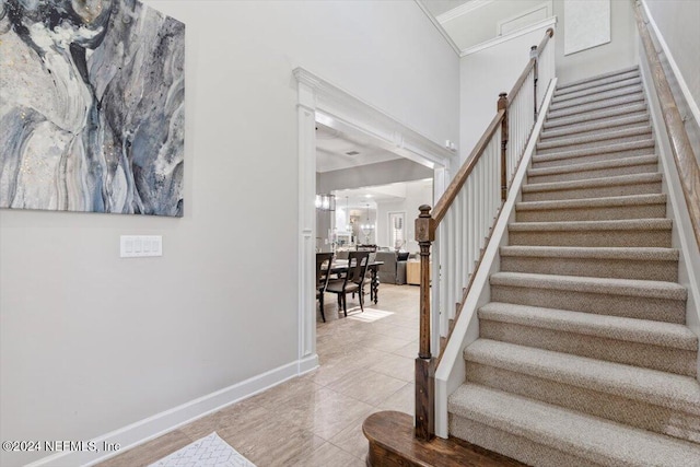 stairs with tile patterned floors