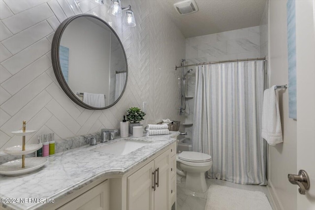 full bathroom featuring toilet, vanity, tile walls, a textured ceiling, and shower / bathtub combination with curtain