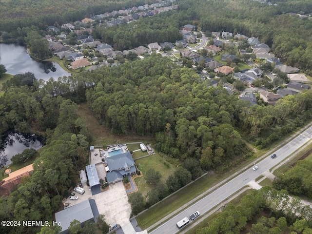 drone / aerial view with a water view