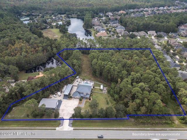 10225 Russell Sampson Rd, Saint Johns, FL 32259 - aerial overview of property's location with a large body of water, a heavily wooded area, and property parcel outlined