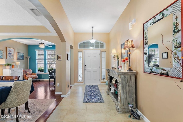 entryway featuring light hardwood / wood-style flooring and ceiling fan