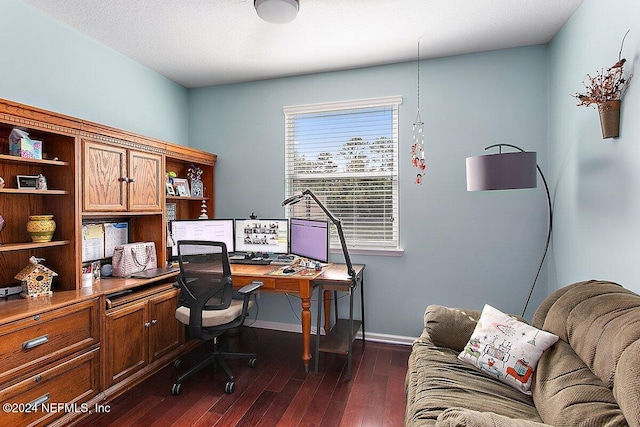 home office featuring a textured ceiling and dark hardwood / wood-style flooring