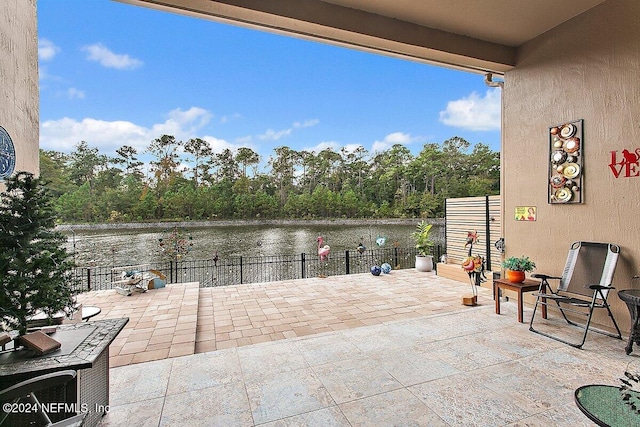 view of patio featuring a water view