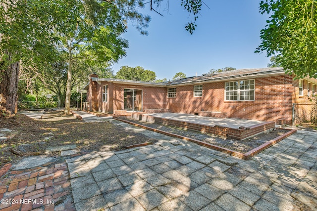 rear view of house with a patio