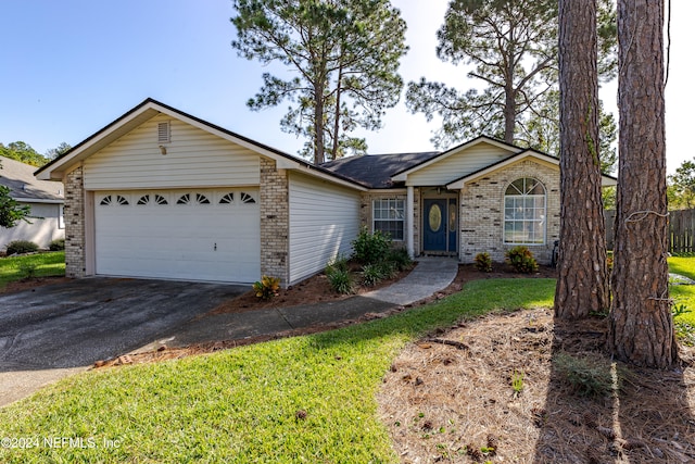 single story home with a front lawn and a garage