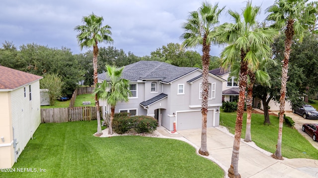 view of front of home featuring a garage and a front lawn