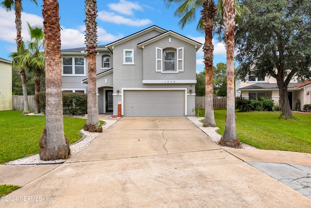 view of front of home featuring a garage and a front yard