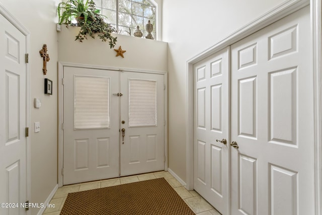 entrance foyer featuring light tile patterned flooring