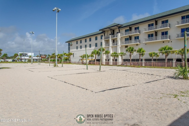 view of home's community featuring volleyball court