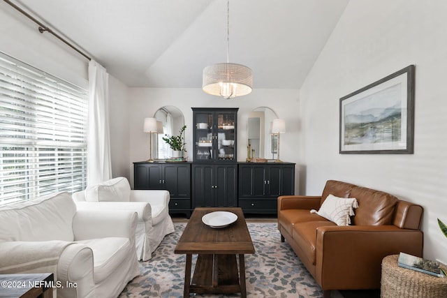 living room featuring vaulted ceiling