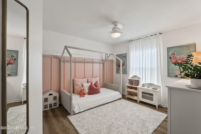 bedroom with dark wood-type flooring and ceiling fan