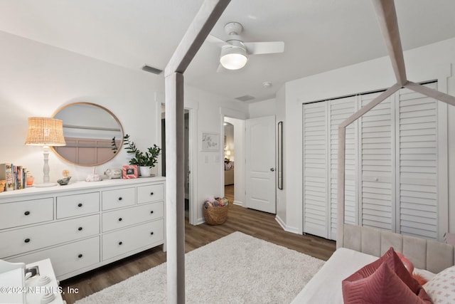 bedroom with a closet, ceiling fan, and dark hardwood / wood-style floors