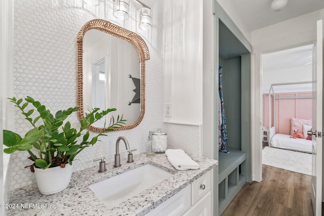 bathroom featuring vanity and hardwood / wood-style flooring