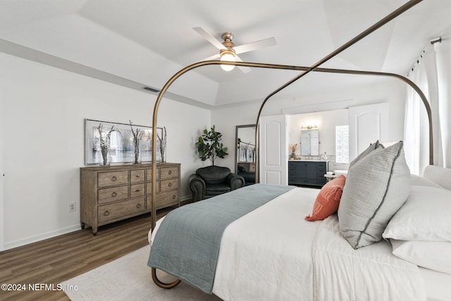 bedroom with connected bathroom, ceiling fan, and hardwood / wood-style flooring