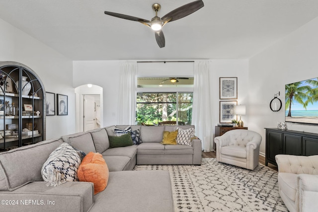 living room featuring light hardwood / wood-style flooring and ceiling fan