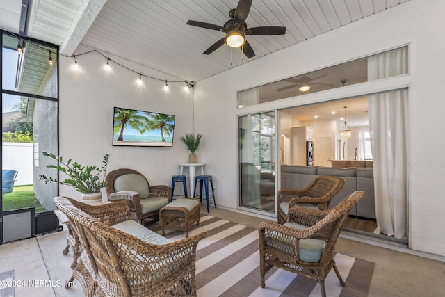 view of patio / terrace featuring ceiling fan and an outdoor living space