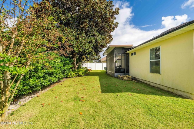 view of yard with a sunroom