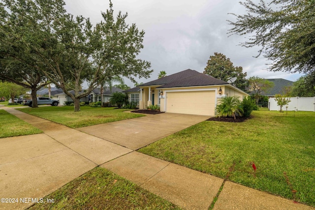 ranch-style home with a front yard and a garage