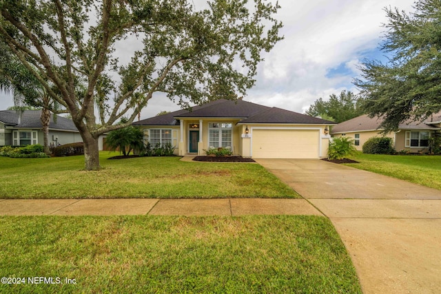 ranch-style home with a front yard and a garage