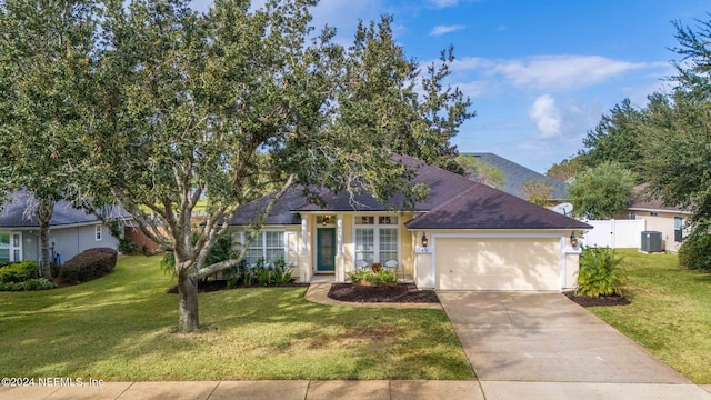 view of front of house with a front yard and a garage