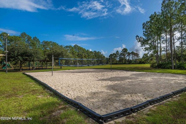 view of community featuring a yard and volleyball court