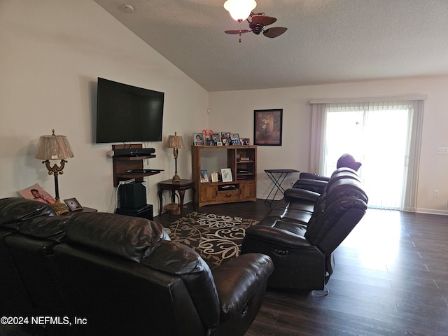 living room with lofted ceiling, a textured ceiling, dark wood-type flooring, and ceiling fan