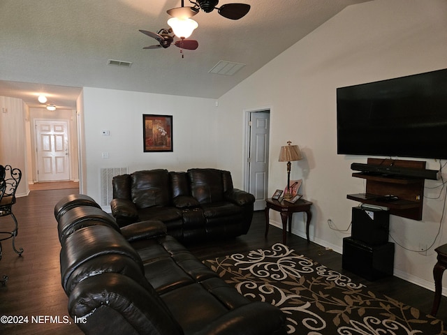 living room with ceiling fan, a textured ceiling, vaulted ceiling, and dark hardwood / wood-style floors