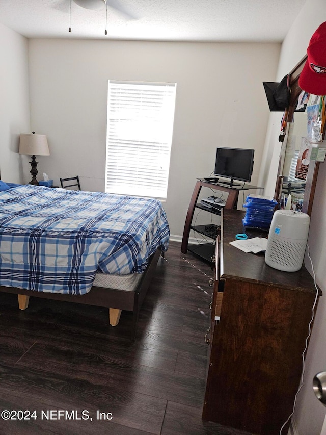 bedroom featuring dark hardwood / wood-style floors