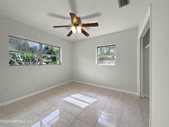 unfurnished bedroom featuring light tile patterned floors and ceiling fan