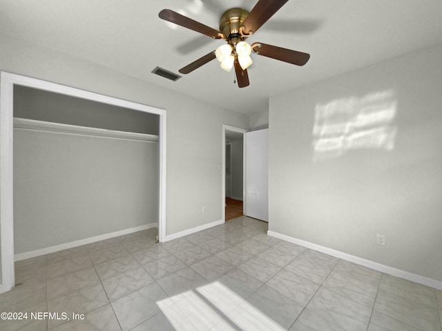 unfurnished bedroom featuring a closet and ceiling fan