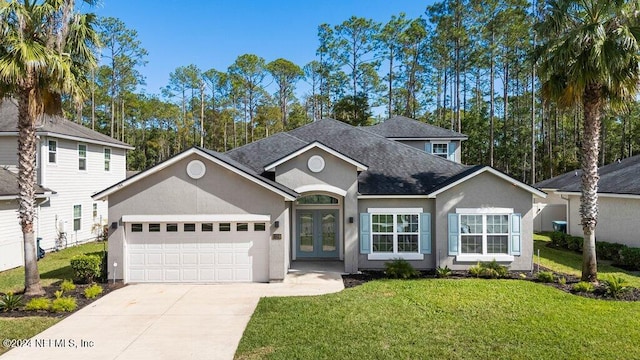 view of front of home featuring a front lawn and a garage