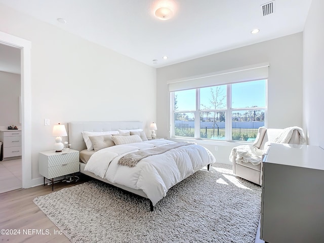 bedroom with light hardwood / wood-style flooring