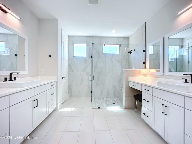 bathroom featuring tile patterned floors, vanity, and walk in shower