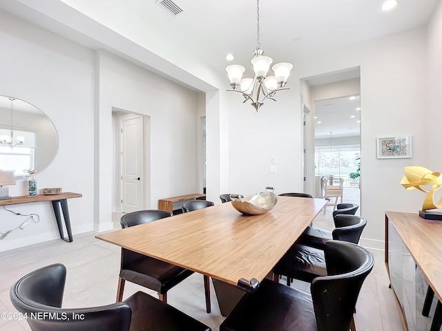 dining space featuring a notable chandelier