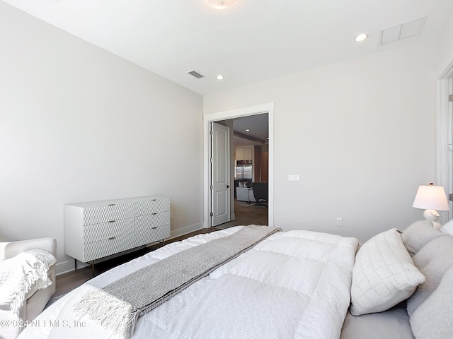 bedroom featuring dark hardwood / wood-style flooring