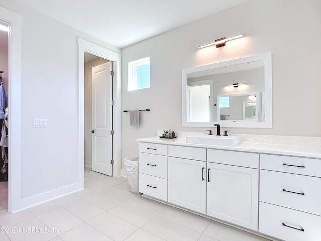 bathroom with tile patterned floors and vanity