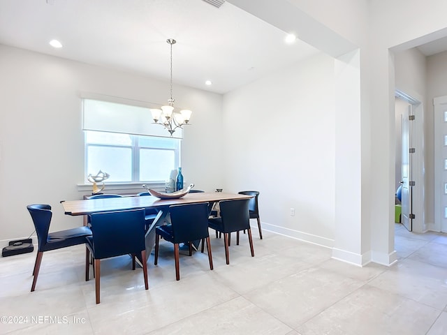 dining room featuring a chandelier