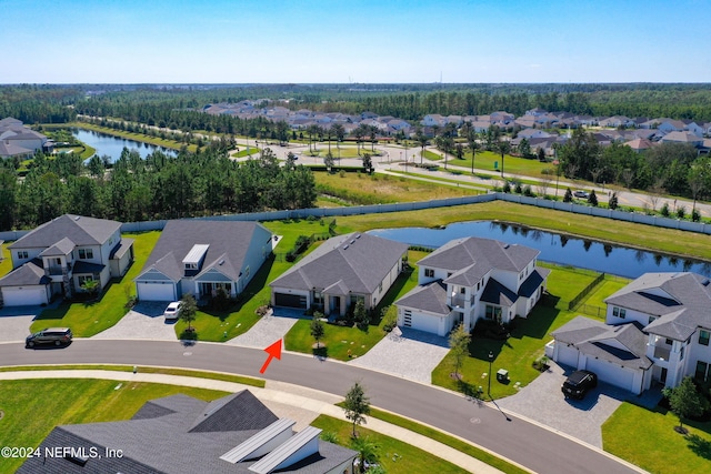 birds eye view of property with a water view