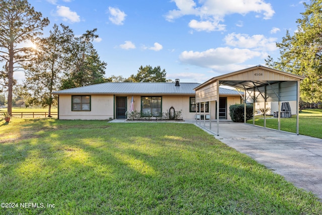 single story home featuring a front yard and a carport